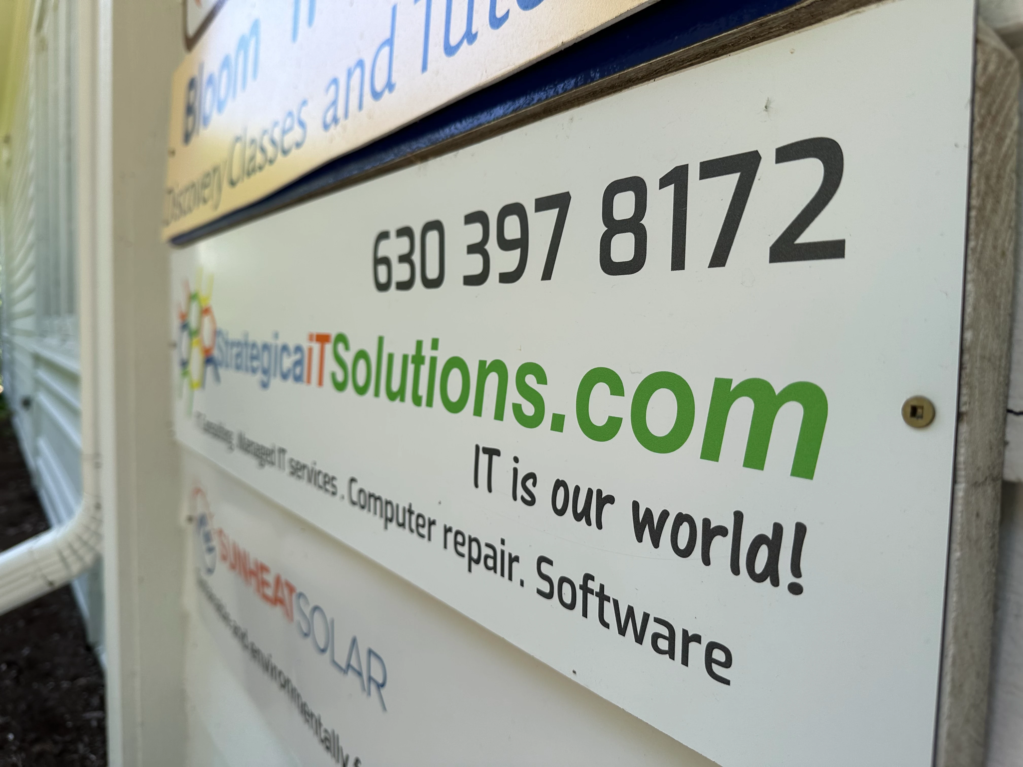 an sign of Strategica IT Solutions reading IT is our world.